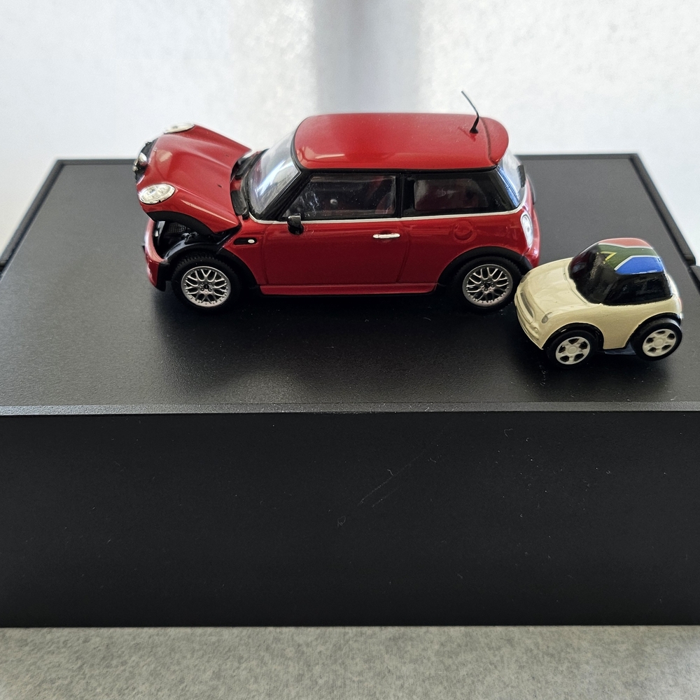 Miniature Red and Cream Toy Car Set